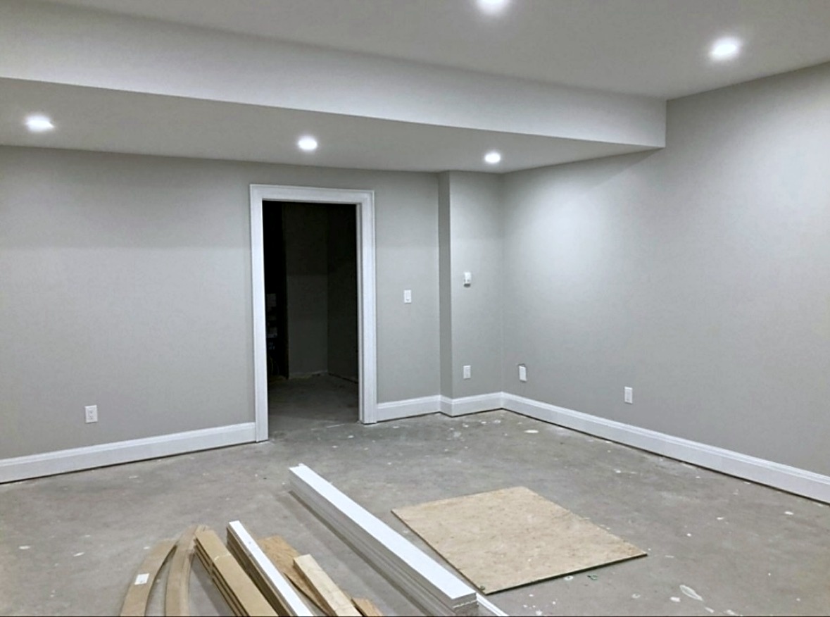 Finished interior room with sloped ceiling and crisp trim